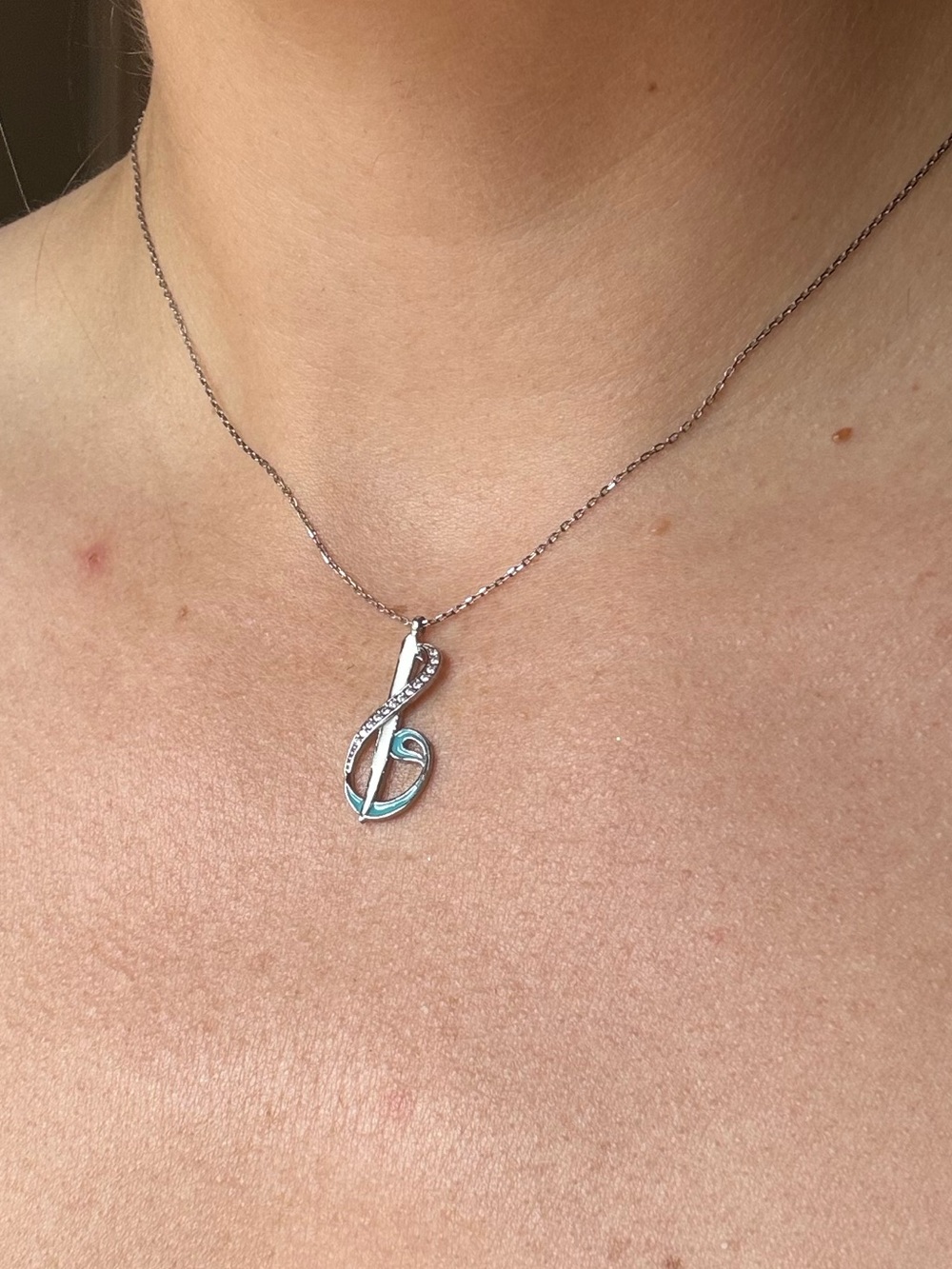 Treble G clef pendant necklace. Music note. Silver with white and blue enamel.